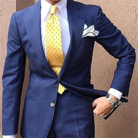 navy suit yellow tie.